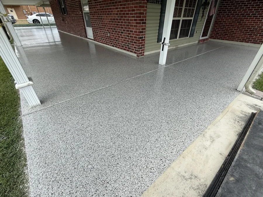 Grey flake coating on a residential porch and walkway