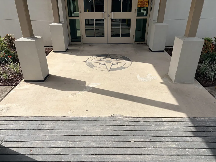 Custom compass rose medallion set into a polished entryway floor