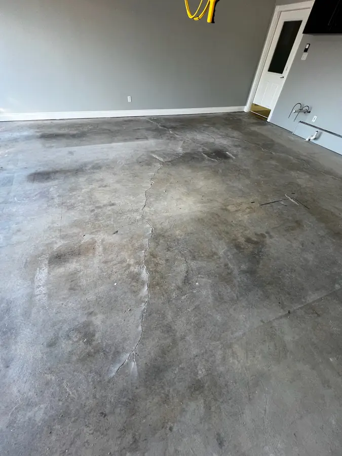 Worn garage slab before coating