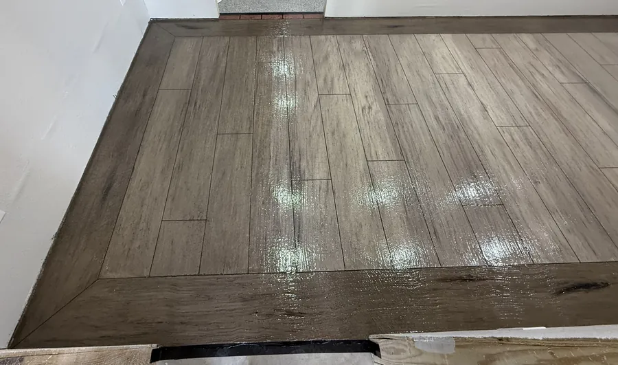 Gray wood plank overlay with a dark border inlay