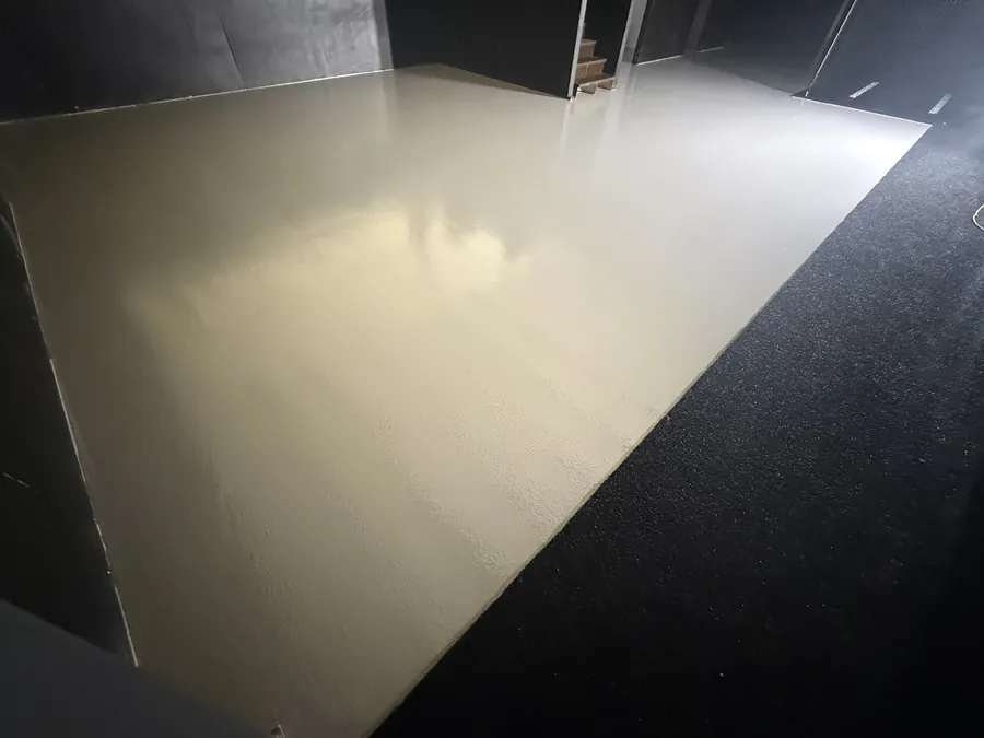 High-gloss polished concrete floor in a large open shop