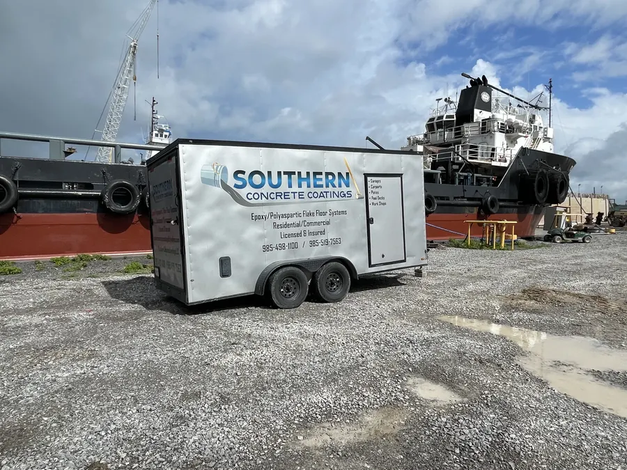 Southern Concrete Coatings trailer beside an offshore supply vessel at the dock