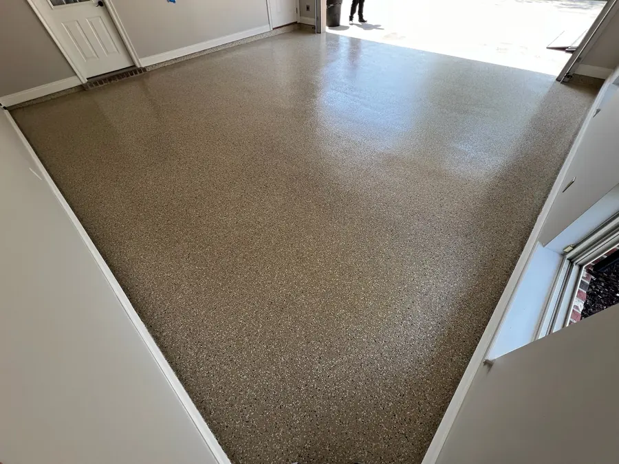 Tan flake floor across an open garage