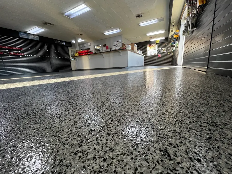 High-gloss black and grey flake floor in a retail showroom