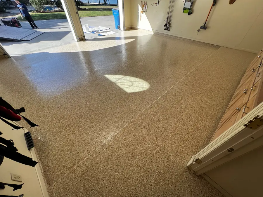 Tan flake garage floor with a gloss finish