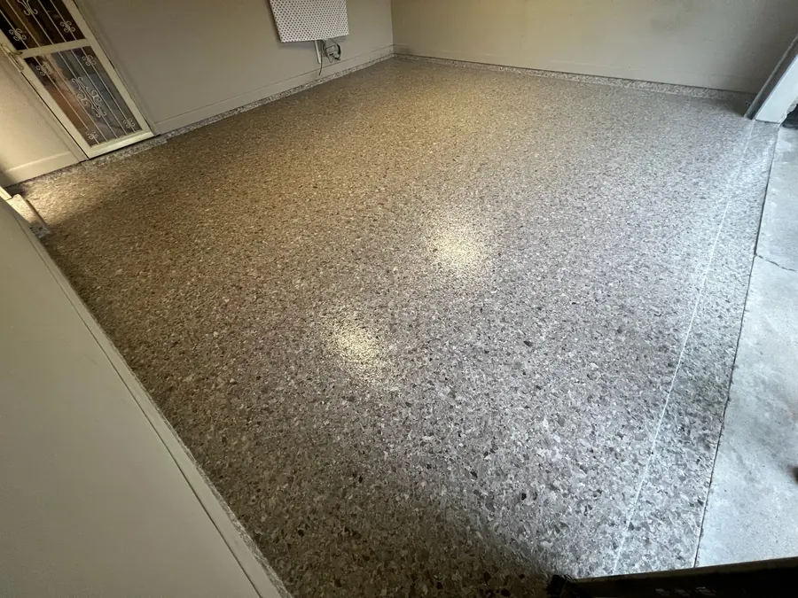 Tan and brown flake coating across a garage