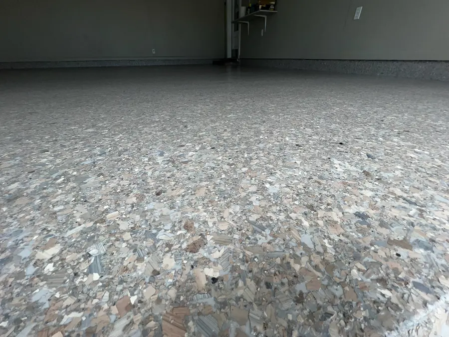 Close-up of a tan, grey and slate flake blend