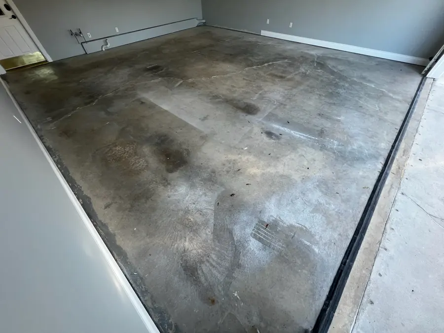 Stained garage slab before coating