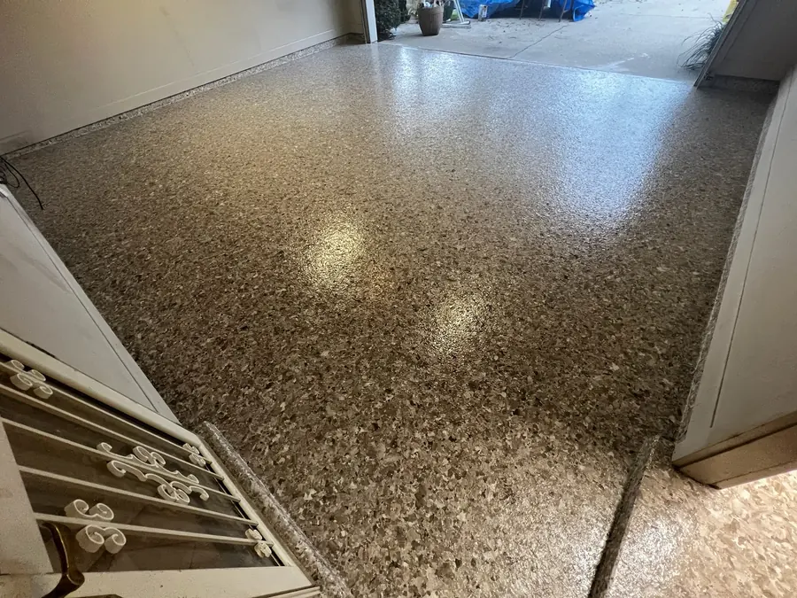 Tan flake garage floor with a glossy finish