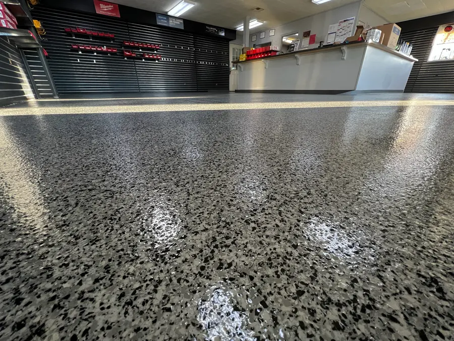 Showroom flake floor reflecting the overhead lights
