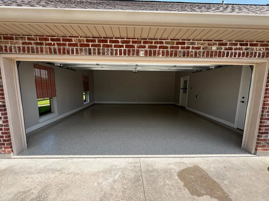 Two-car garage with a new flake floor, seen from the driveway