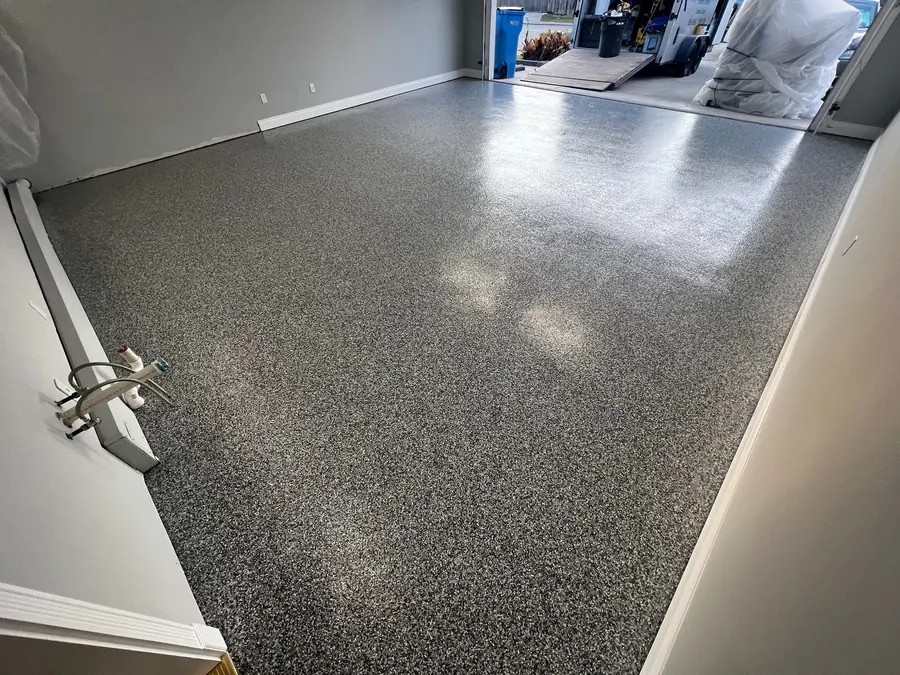 Grey flake garage floor with a gloss finish to the door